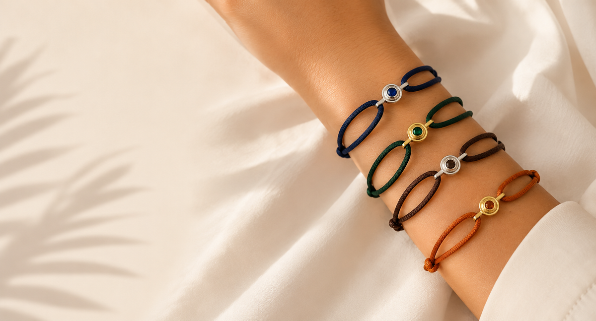 Customizable friendship bracelets in navy, hunter green, brown and rust silk cord with interchangeable IT charms