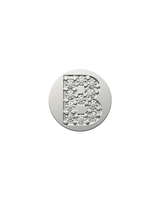 Silver charm with letter 'B' design on a white background